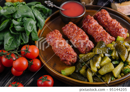 Meat rolls mititei or mici traditional romanian food Meat rolls mititei or mici traditional romanian food 95144205