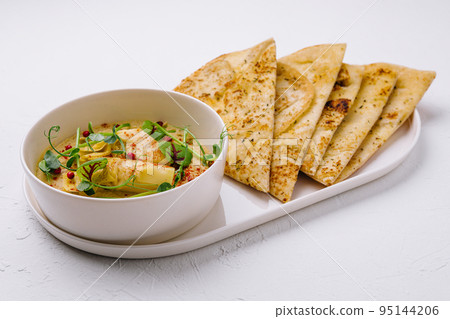 Cream of artichoke on white bowl Cream of artichoke on white bowl 95144206