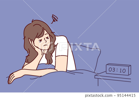 Exhausted woman sit in bed suffer from insomnia 95144415