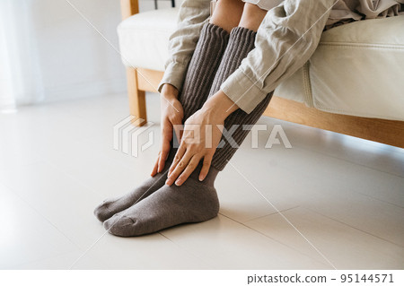 Women wearing warm socks, measures against coldness Women wearing warm socks, measures against coldness 95144571