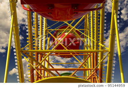 Attraction (carousel) ferris wheel against the background of a romantic evening sky 95144959