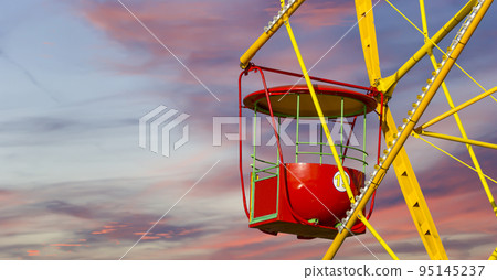 Attraction (carousel) ferris wheel against the background of a romantic evening sky 95145237