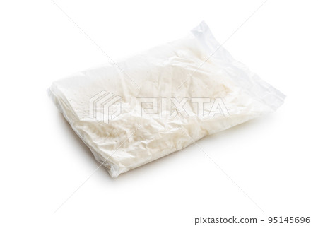 Uncooked rice in cooking sack isolated on white background. 95145696