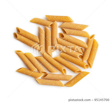 Uncooked whole grain pasta isolated on white background. Raw penne pasta. Uncooked whole grain pasta isolated on white background. Raw penne pasta. 95145700