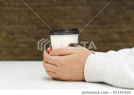 Two Hands Hold Coffee Cup, Warming Hands, Hugging Warm Coffee Mug Mockup Two Hands Hold Coffee Cup, Warming Hands, Hugging Warm Coffee Mug Mockup 95145926