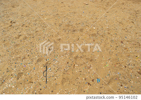 Microplastics on Sand Beach 95146102