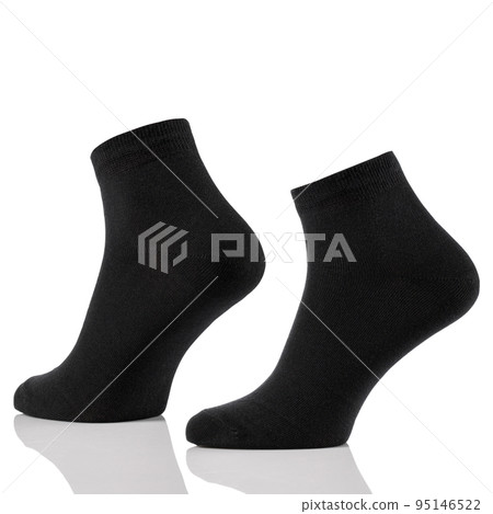 Black cotton short sock on invisible foots isolated on white background. Black cotton short sock on invisible foots isolated on white background. 95146522