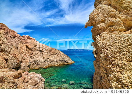 Greek island landscape, limestone cliffs azure sea, blue sky, vacation. Idyllic destination, summer escape.  95146866