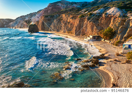 Beautiful sunset view of Fyriplaka beach, Milos island, Greece. Greek vacations, Aegean sea, rocky landscape, azure waters, sandy beach. 95146876