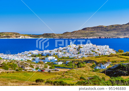 Beautiful view of Adamantas, main town of Milos island, Greece, on sunny day. Hill top town, whitewashed houses, church bell tower, Beautiful view of Adamantas, main town of Milos island, Greece, on sunny day. Hill top town, whitewashed houses, church bell tower, 95146880