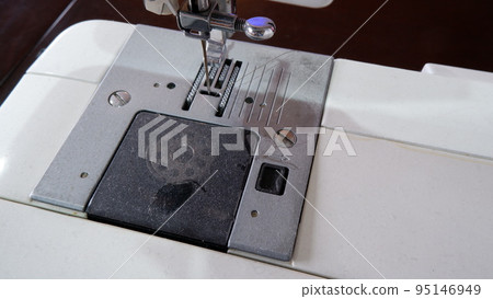 hand of sewing machine hand of sewing machine 95146949