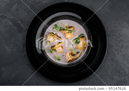 Creamy mushroom soup with champignons top view 95147626