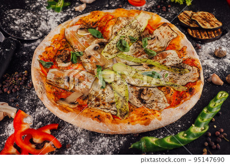 italian vegetarian pizza with zucchini, eggplant, mushrooms and tomato 95147690