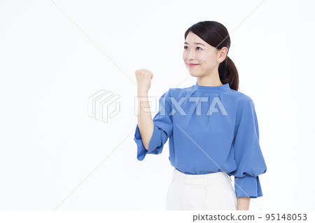 Business woman in her thirties doing a guts pose Business woman in her thirties doing a guts pose 95148053