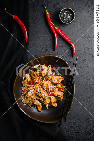 Stir fry noodles with vegetables and chicken in a black bowl Stir fry noodles with vegetables and chicken in a black bowl 95149121