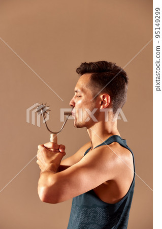 Young man testing breathing function by breath a cizer. Take care about health. Young man testing breathing function by breath a cizer. Take care about health. 95149299