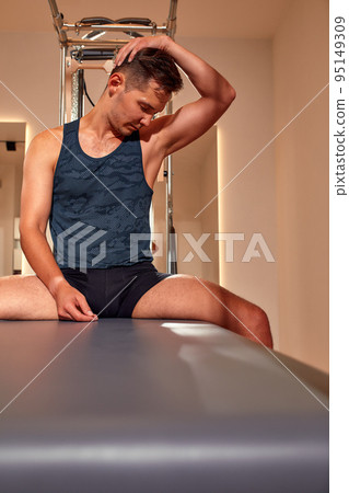 Fit man doing a lunge stretch yoga pilates - Stock Photo [95149309] -  PIXTA