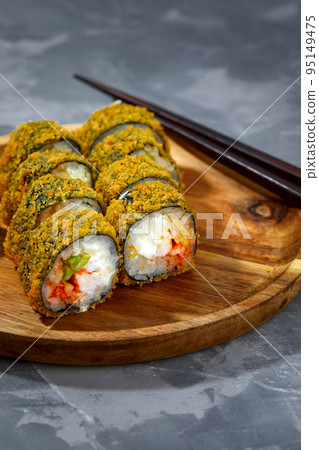 Tempura Maki Sushi Deep Fried Sushi Roll Served on wooden board 95149475