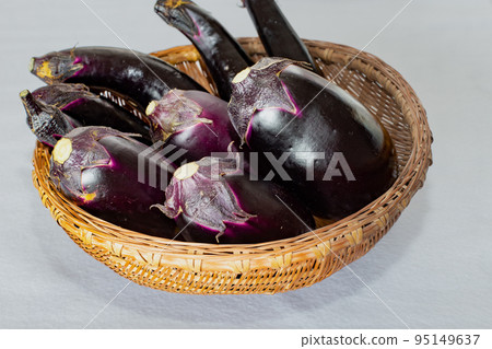 Harvesting in the kitchen garden (eggplants and round eggplants on a colander) Harvesting in the kitchen garden (eggplants and round eggplants on a colander) 95149637
