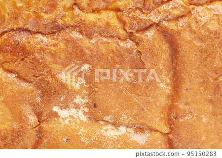The texture of the crust of bread. Tasty fresh bread, close up. The texture of the crust of bread. Tasty fresh bread, close up. 95150283
