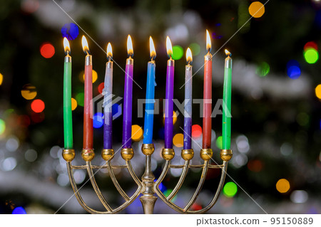Hanukkiah Menorah with burned candles on blurred bokeh in Jewish holiday symbol for Hanukkah Hanukkiah Menorah with burned candles on blurred bokeh in Jewish holiday symbol for Hanukkah 95150889