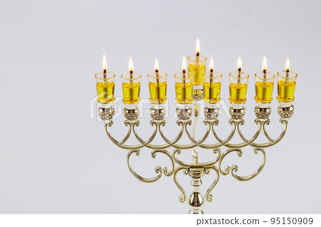 Candles for Hanukkah festival symbols have been lit in Menorah Jewish holiday with white background 95150909