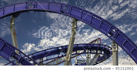 Attraction roller-coaster (switchback) on the background of the cloudy sky Attraction roller-coaster (switchback) on the background of the cloudy sky 95152001