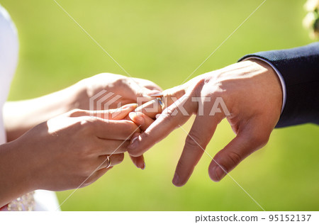 Wedding engagement rings. Married couple exchange wedding rings at a wedding ceremony. Wedding engagement rings. Married couple exchange wedding rings at a wedding ceremony. 95152137