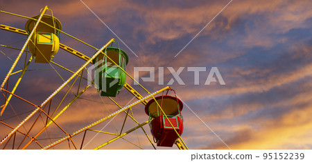 Attraction (carousel) ferris wheel against the background of a romantic evening sky 95152239