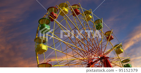 Attraction (carousel) ferris wheel against the background of a romantic evening sky 95152379