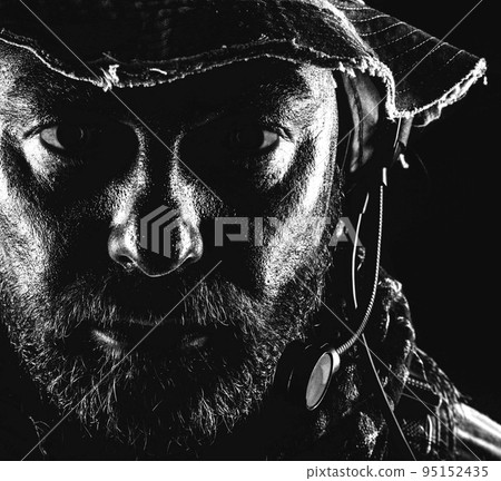 Special forces United States in Camouflage Uniforms studio shot. Wearing jungle hat, Shemagh scarf, painted face. Black background, bottom light colorized toned contour shor Special forces United States in Camouflage Uniforms studio shot. Wearing jungle hat, Shemagh scarf, painted face. Black background, bottom light colorized toned contour shor 95152435