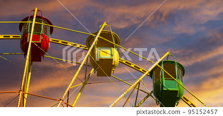 Attraction (carousel) ferris wheel against the background of a romantic evening sky 95152457