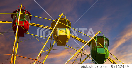 Attraction (carousel) ferris wheel against the background of a romantic evening sky 95152459