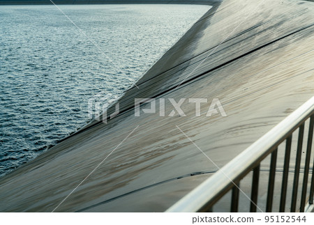 HDPE lined water reservoirs for power generating stations. HDPE plastic for seepage control and leakage prevention of water in reservoirs. High density polyethylene engineering material. Black plastic HDPE lined water reservoirs for power generating stations. HDPE plastic for seepage control and leakage prevention of water in reservoirs. High density polyethylene engineering material. Black plastic 95152544