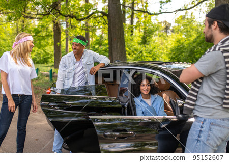 Group of young people discussing their car accident and making plan together Group of young people discussing their car accident and making plan together 95152607