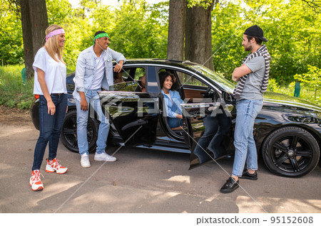 Group of young people discussing their car accident and making plan together Group of young people discussing their car accident and making plan together 95152608