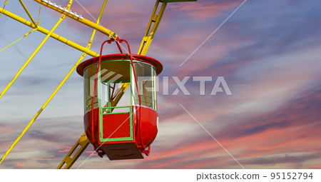 Attraction (carousel) ferris wheel against the background of a romantic evening sky Attraction (carousel) ferris wheel against the background of a romantic evening sky 95152794