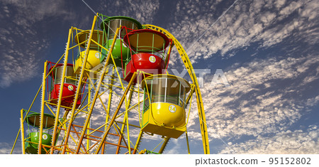 Attraction (carousel) ferris wheel against the background of a romantic evening sky 95152802