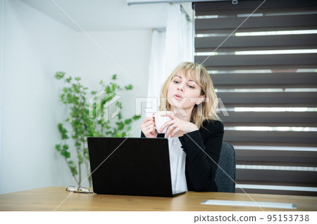 Thinking woman working in the office Thinking woman working in the office 95153738