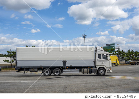 A truck stopped at a highway rest area 95154499