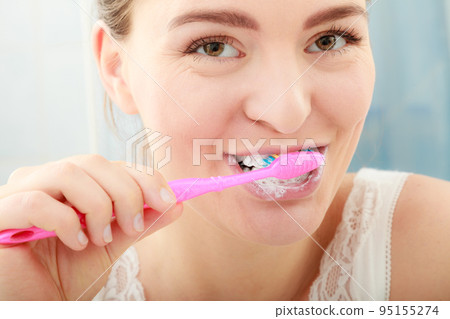 Woman brushing cleaning teeth. Oral hygiene. Woman brushing cleaning teeth. Oral hygiene. 95155274