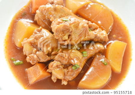 boiled chicken leg with potato in swet red gravy sauce stew on plate 95155718