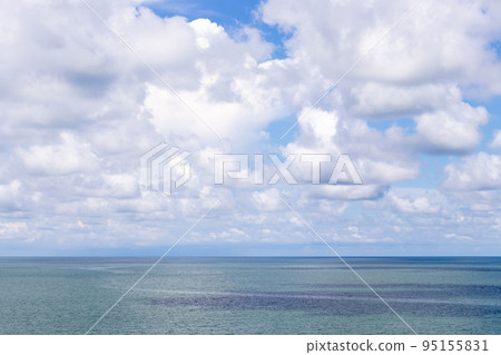 Beautiful calm turquoise color sea and blue sky with white color cloud background 95155831
