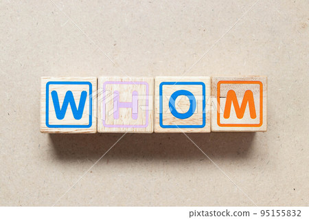 Color letter block in word whom on wood background 95155832