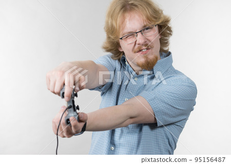 Gamer man holding gaming pad 95156487