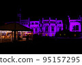 Large house and white banquet wedding tent at night 95157295