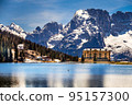 Alpine hotel with mountains, lake and forest 95157300
