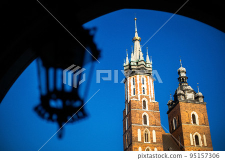Church of St. Mary in the main Market Square on the background of dramatic sky Church of St. Mary in the main Market Square on the background of dramatic sky 95157306