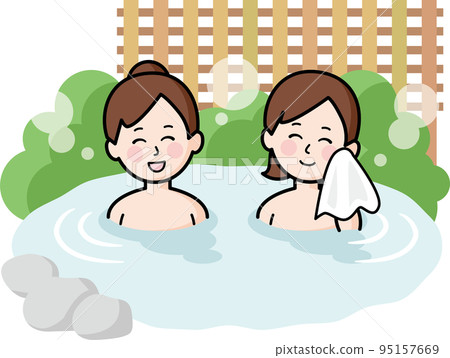 A woman entering a hot spring 95157669