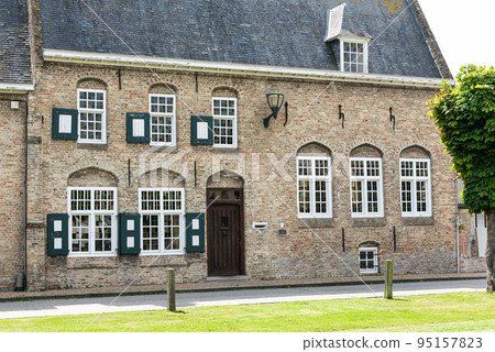 Lo-rening, West Flanders Region - Belgium - Traditional houses in the village at the Flemish countryside Lo-rening, West Flanders Region - Belgium - Traditional houses in the village at the Flemish countryside 95157823